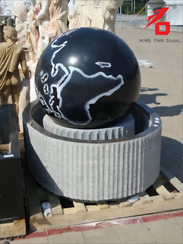 Fuente con pelota de granito